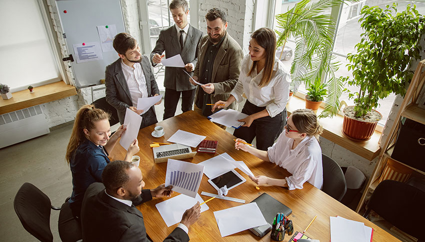 Group of People working around a table